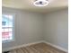 Bright bedroom features a modern ceiling fan and a large window that provides plenty of natural light at 2039 Gober Ave Se, Smyrna, GA 30080
