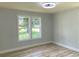 Cozy bedroom featuring natural light from two windows and sleek hardwood floors at 2039 Gober Ave Se, Smyrna, GA 30080