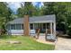 Attractive single-story house with a brick chimney and welcoming front porch at 2039 Gober Ave Se, Smyrna, GA 30080