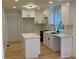 Modern kitchen with white cabinets, quartz countertops, and stainless steel appliances at 2039 Gober Ave Se, Smyrna, GA 30080
