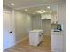 Bright kitchen with white cabinets, a center island, and modern fixtures at 2039 Gober Ave Se, Smyrna, GA 30080