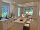 Bright kitchen and dining space features quartz counters, island with stools, and seating for 4 at 2039 Gober Ave Se, Smyrna, GA 30080