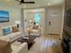 Nicely staged living room with a comfortable seating area and decorative accents by the fireplace at 2039 Gober Ave Se, Smyrna, GA 30080