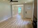 Open-concept living room showcasing stylish floors, fresh paint, and a contemporary ceiling fan at 2039 Gober Ave Se, Smyrna, GA 30080