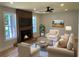 The living room boasts a modern fireplace, recessed lighting, an open floor plan, and is virtually staged at 2039 Gober Ave Se, Smyrna, GA 30080