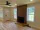 Bright living room featuring a modern fireplace, beautiful hardwood floors, and large windows at 2039 Gober Ave Se, Smyrna, GA 30080