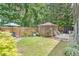 Lush backyard featuring a gazebo, charming seating arrangements, and well-maintained lawn at 3347 Sable Run Rd, Atlanta, GA 30349