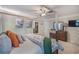 This bedroom features a bed, a ceiling fan, a dresser and decor at 3347 Sable Run Rd, Atlanta, GA 30349