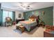 Bedroom featuring a unique decorative accent wall, ceiling fan, and various furniture pieces at 3347 Sable Run Rd, Atlanta, GA 30349
