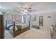 This bedroom features a canopy bed, ceiling fan, a dresser and decor at 3347 Sable Run Rd, Atlanta, GA 30349