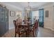 Elegant dining room featuring hardwood floors, stylish table setting, and a modern chandelier at 3347 Sable Run Rd, Atlanta, GA 30349