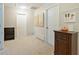 Hallway features neutral carpeting, crisp white doors, and tasteful decor adding warmth and character to the home's interior at 3347 Sable Run Rd, Atlanta, GA 30349