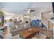 Spacious open concept living room with comfortable seating, fireplace, and access to kitchen at 3347 Sable Run Rd, Atlanta, GA 30349