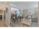 Cozy living room featuring stylish furniture, wood-look accent wall, and abundant natural light at 3347 Sable Run Rd, Atlanta, GA 30349