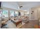 Cozy living room with open concept design, featuring fireplace, comfortable seating, and lots of natural light at 3347 Sable Run Rd, Atlanta, GA 30349