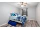 Cozy bedroom with light gray walls, ceiling fan, and wood-look flooring at 3470 Hill Ln, Acworth, GA 30102