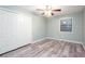 Bedroom featuring natural light, a ceiling fan, and wood laminate flooring at 3470 Hill Ln, Acworth, GA 30102