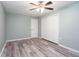 Bedroom featuring natural light, a ceiling fan, and wood laminate flooring at 3470 Hill Ln, Acworth, GA 30102