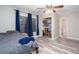 Bright bedroom featuring plank floors, a ceiling fan, a window, closet, and bathroom access at 3470 Hill Ln, Acworth, GA 30102