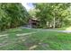 A large home with a long driveway, surrounded by trees and lawn at 3470 Hill Ln, Acworth, GA 30102
