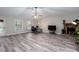Bright living room showcasing hardwood floors, a fireplace, and ample natural light at 3470 Hill Ln, Acworth, GA 30102