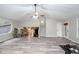 Open living space featuring hardwood floors, stairs, and multiple windows for natural light at 3470 Hill Ln, Acworth, GA 30102