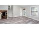 Bright living room with hardwood floors, a staircase, and plenty of natural light at 3470 Hill Ln, Acworth, GA 30102