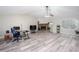 Spacious living room featuring hardwood floors, a fireplace, and a ceiling fan at 3470 Hill Ln, Acworth, GA 30102