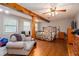 Spacious main bedroom features hardwood floors, ceiling fan, and a comfortable seating area at 3470 Hill Ln, Acworth, GA 30102