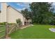 Private backyard view features an elevated deck, lush greenery, and meticulous landscaping, creating a perfect retreat at 388 Rose Creek Pl, Woodstock, GA 30189