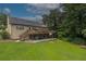 Expansive backyard with a spacious deck, perfect for outdoor entertaining and relaxation on a sunny day at 388 Rose Creek Pl, Woodstock, GA 30189