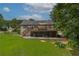 Lush backyard featuring an elevated deck, offering stunning views and plenty of space for outdoor enjoyment at 388 Rose Creek Pl, Woodstock, GA 30189