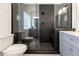 Sleek bathroom boasts a glass shower, with tile surround, and gray vanity at 388 Rose Creek Pl, Woodstock, GA 30189