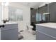 Modern bathroom features gray vanity, white shiplap, and a sliding glass shower at 388 Rose Creek Pl, Woodstock, GA 30189