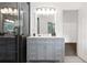 Sleek bathroom boasts a glass shower with tile surround and modern vanity at 388 Rose Creek Pl, Woodstock, GA 30189