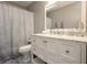 Bathroom showcasing a white vanity with marble countertop and modern fixtures at 388 Rose Creek Pl, Woodstock, GA 30189