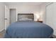 Bedroom with gray walls, a large bed, and a double closet at 388 Rose Creek Pl, Woodstock, GA 30189