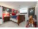 Decorated bedroom with sports theme and large window for natural light at 388 Rose Creek Pl, Woodstock, GA 30189