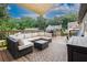 Expansive deck area with an outdoor sectional, glass top table, and shade awning at 388 Rose Creek Pl, Woodstock, GA 30189