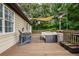 Outdoor deck with comfortable seating, perfect for relaxation and entertaining at 388 Rose Creek Pl, Woodstock, GA 30189