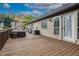 Exterior view of the deck featuring outdoor seating, a shade awning, and surrounding greenery at 388 Rose Creek Pl, Woodstock, GA 30189
