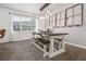 Dining room area with rustic table, bench seating, window, and hanging pendant lighting at 388 Rose Creek Pl, Woodstock, GA 30189