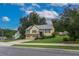 Charming two-story home with a well-manicured lawn and attached two-car garage at 388 Rose Creek Pl, Woodstock, GA 30189