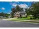 Inviting two-story home with attached garage and a well-maintained front lawn at 388 Rose Creek Pl, Woodstock, GA 30189