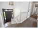 Staircase of home featuring a light and airy foyer with wood-look floors at 388 Rose Creek Pl, Woodstock, GA 30189
