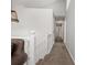 Bright hallway features neutral walls and carpet, leading to bedrooms at 388 Rose Creek Pl, Woodstock, GA 30189
