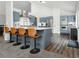 Kitchen with stainless steel appliances, range hood, kitchen island, and breakfast bar seating at 388 Rose Creek Pl, Woodstock, GA 30189