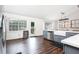 Spacious kitchen featuring stainless steel appliances, a farmhouse sink, and light gray cabinetry at 388 Rose Creek Pl, Woodstock, GA 30189
