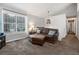 Cozy living area with a large window, comfortable seating, and views of the outdoors at 388 Rose Creek Pl, Woodstock, GA 30189