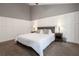 The large main bedroom features board and batten and neutral decor at 388 Rose Creek Pl, Woodstock, GA 30189